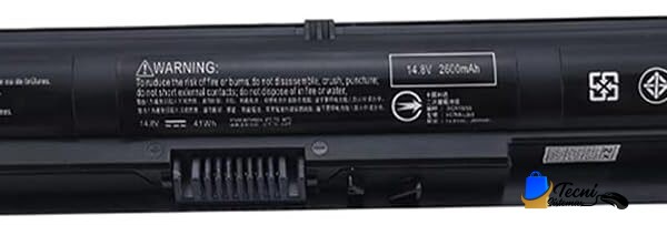 Black notebook computer battery with warning text, model info, and certification icons printed along its side (recycling, CE, Made in China).