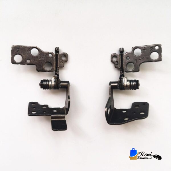Pair of metal toe-clip pedal components with springs, laid side by side on a white background